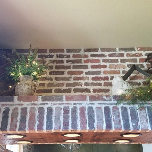 Brick overhang with wood accents